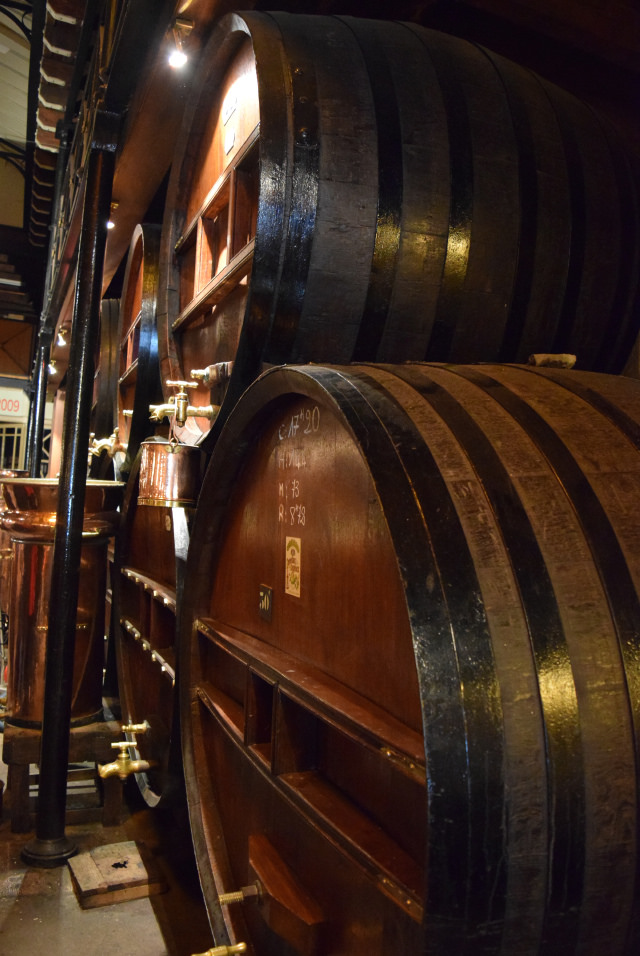 Barrels in the Denoix Distillery, Brive | www.rachelphipps.com @rachelphipps