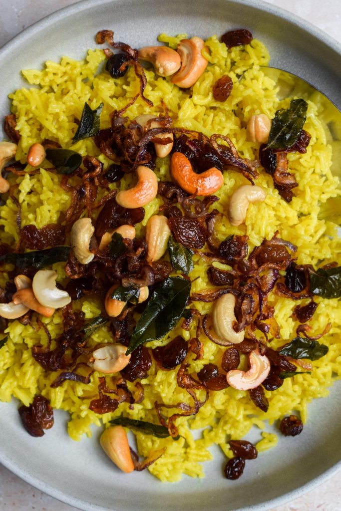 Close up of a plate of yellow rice.