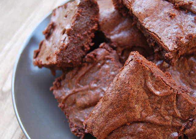 Close up of brownies on a grey plate.