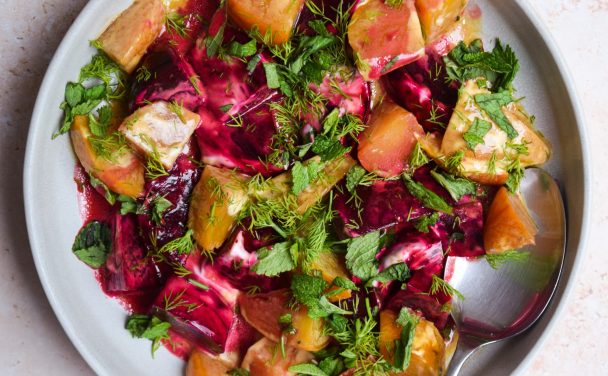 Close up of a Greek beet salad made with yellow and purple beetroot.