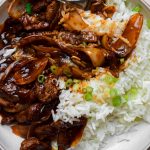 Beef and onion stir fry with rice.