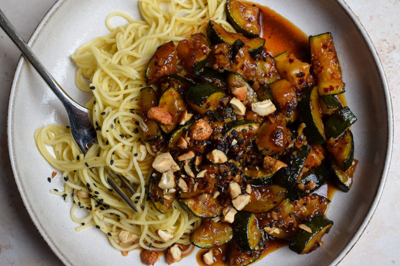 Stir fried courgette served over egg noodles.