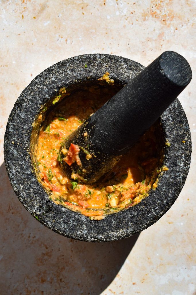 Mortar and pestle of pesto alla Trapanese.
