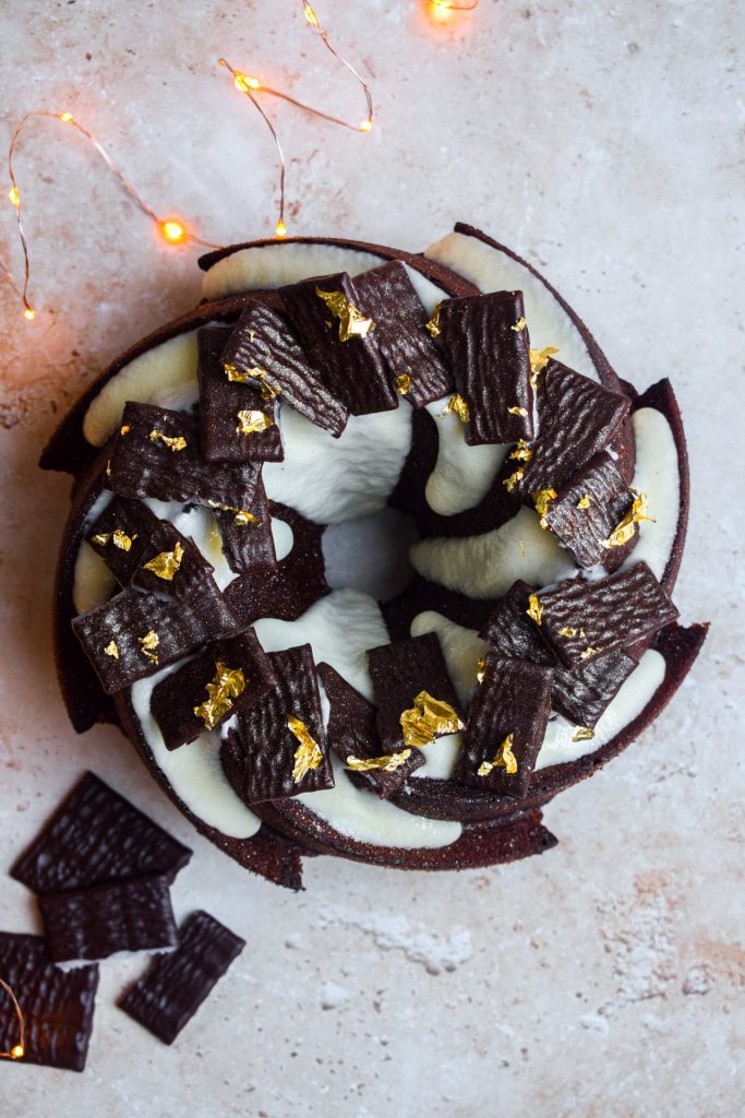 After Eight Bundt Cake with fairy lights and more chocolate around it.