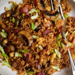Close up of fried rice with bacon and mushrooms.