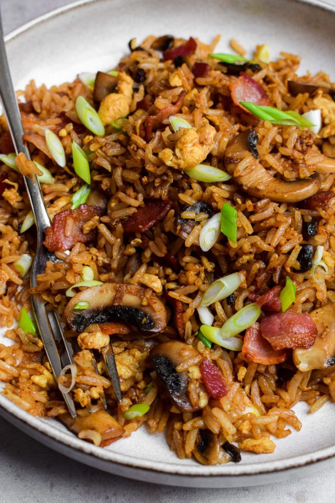 Bowl of bacon and mushroom fried rice.