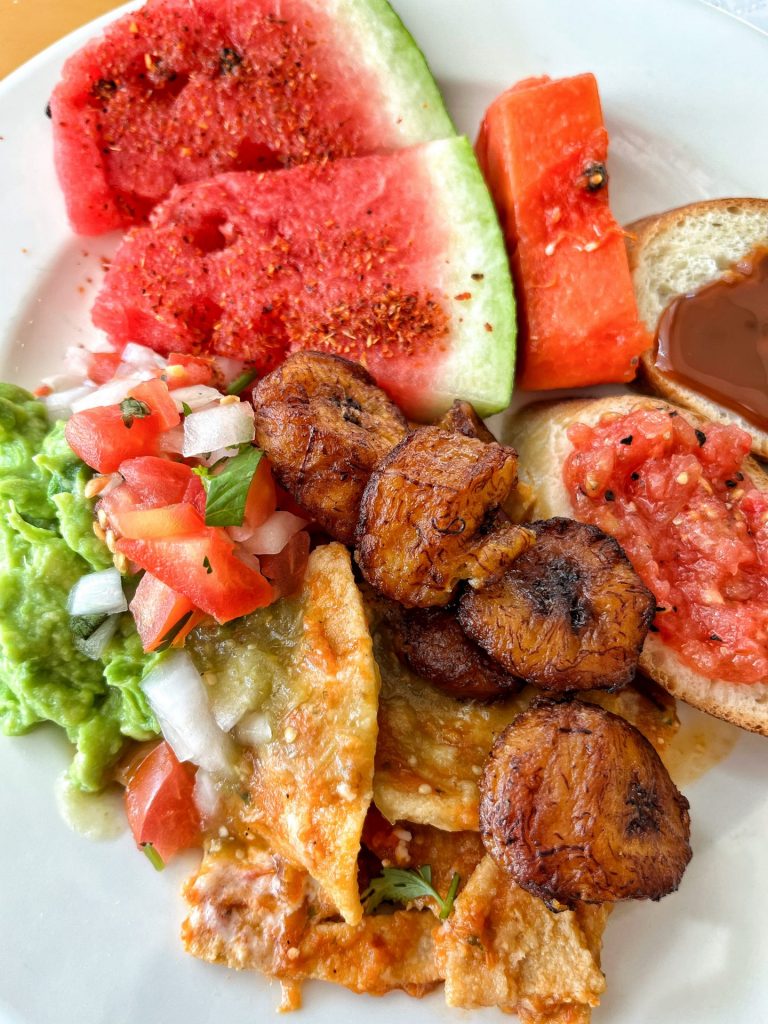 Close up of a plate of Mexican breakfast foods.