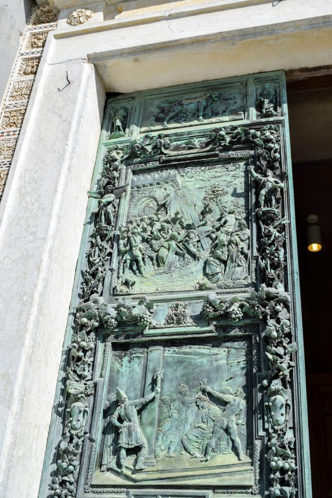 Aged bronze door details on Pisa cathedral
