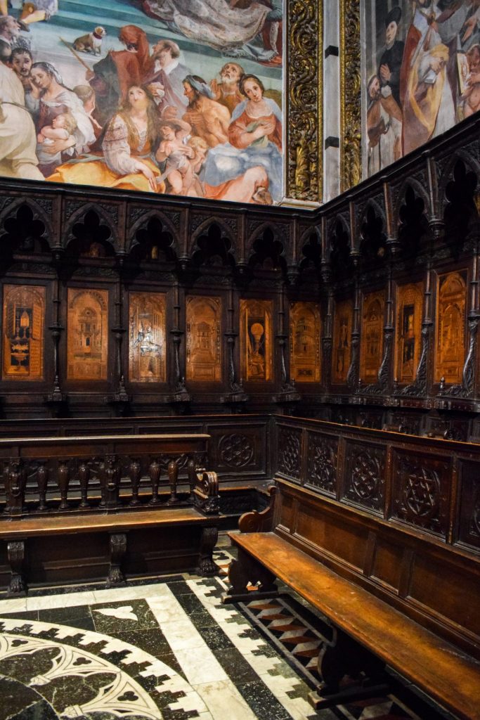 Wooden carved pews in Siena cathedral.