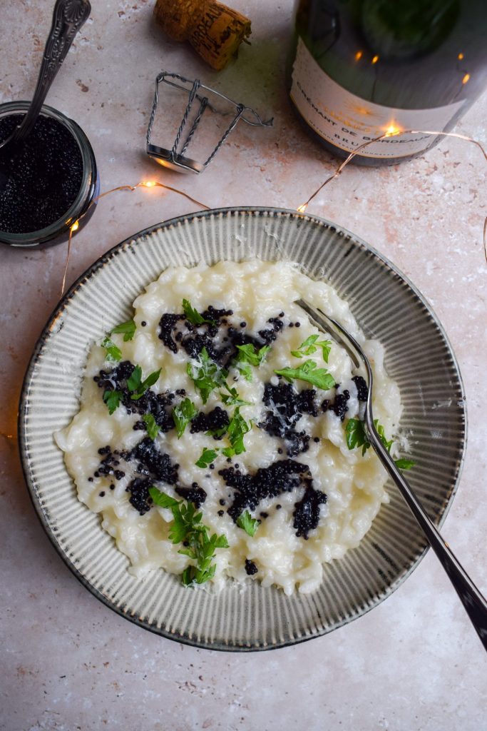Lumpfish caviar and parsley stirred into a risotto.
