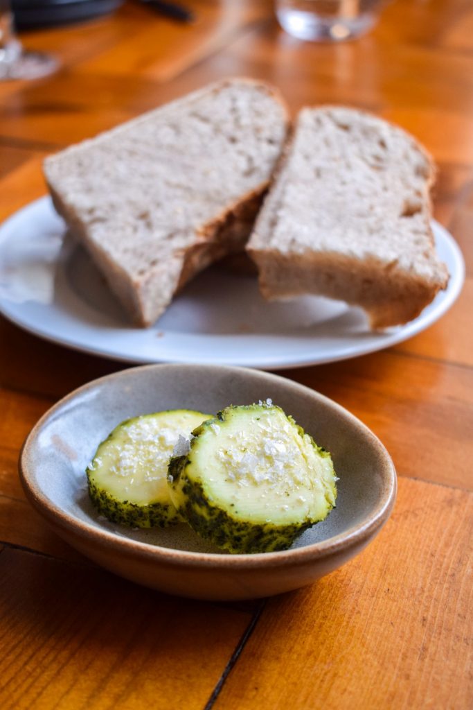 Seaweed butter with bread in the background.