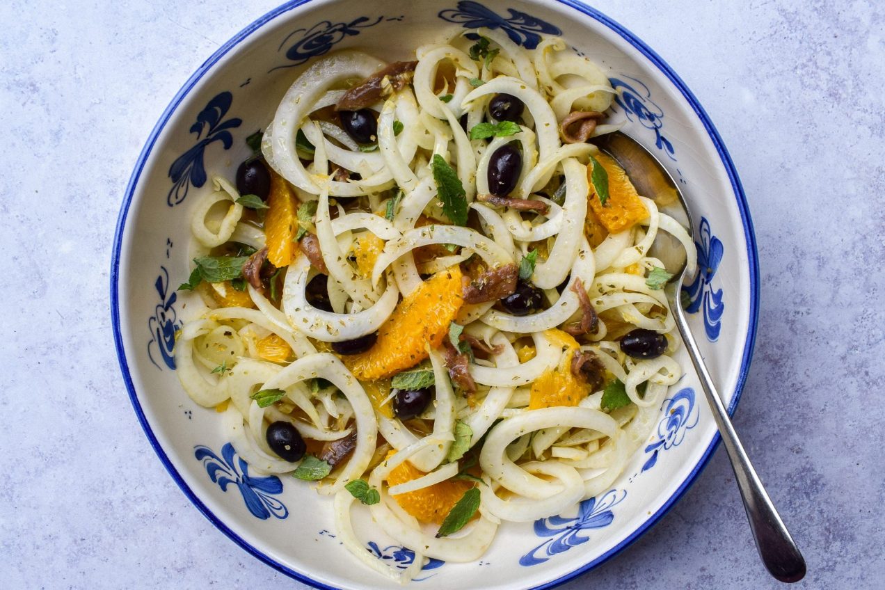 Blue and white bowl of Sicilian fennel and orange salad.