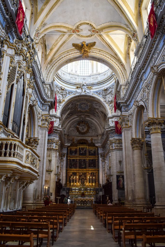 The white and gold nave of Duomo di San Giorgio in Modica.