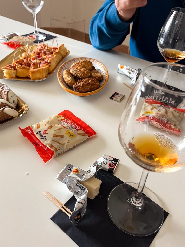 Snacks and glasses of Marsala at a tasting.