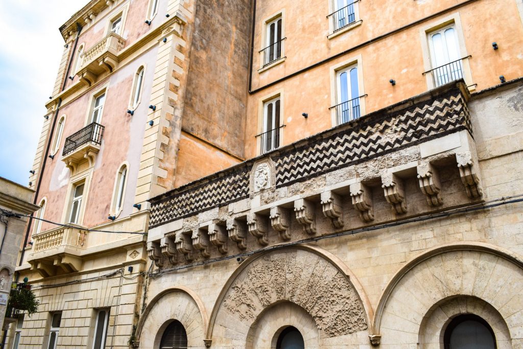 Patterned building facades in Ortigia.
