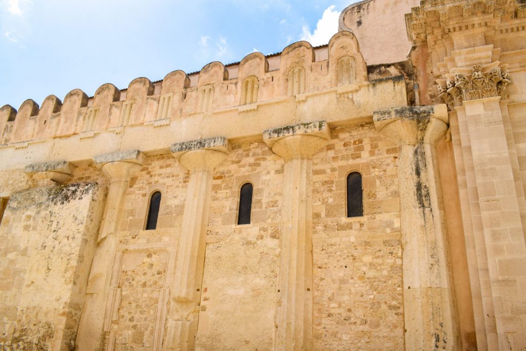 Side view of Syracuse Cathedral showing the ancient temple it was build into.