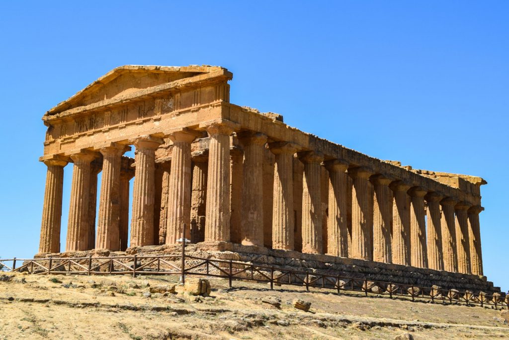 Main Doric temple at the Valley of the Temples set against a clear blue sky.