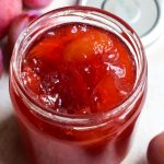 Open jar of Victoria Plum Jam