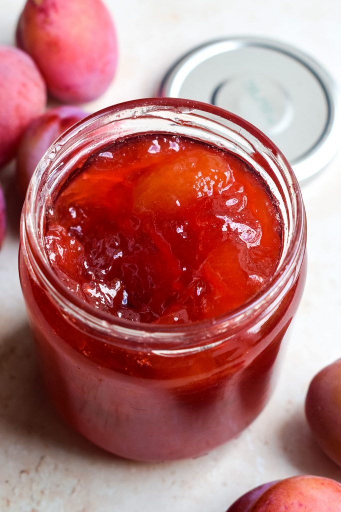 Open jar of Victoria Plum Jam