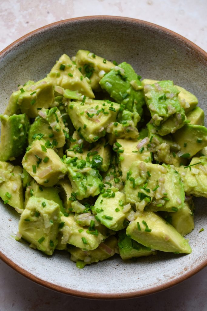 Close up of a stone bowl of French avocado salad.